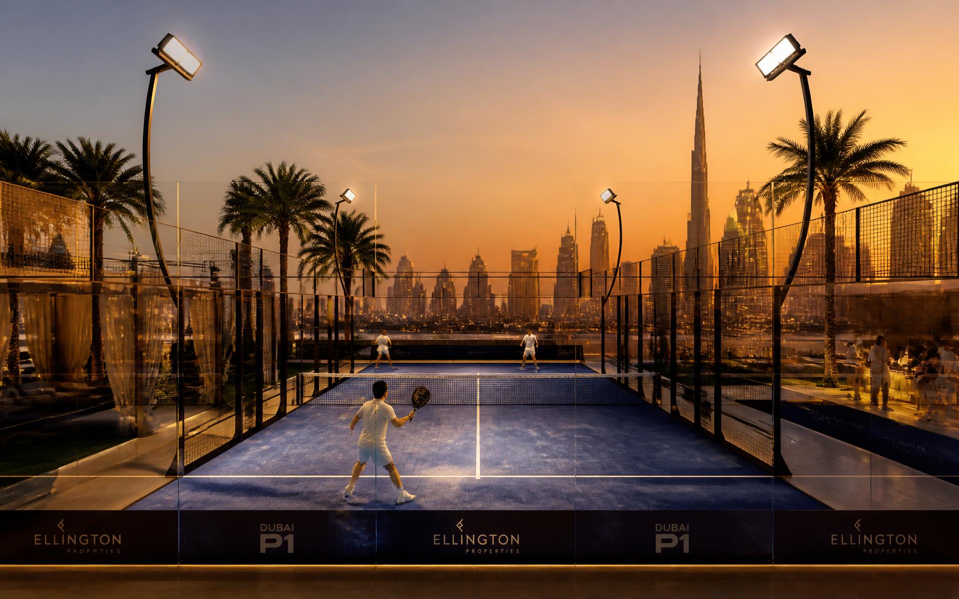 Panoramic padel court at dusk with the Dubai skyline behind